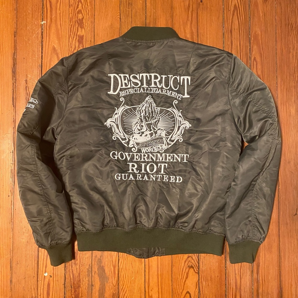 Green bomber jacket back embroidery 
Ask me anything if you have question